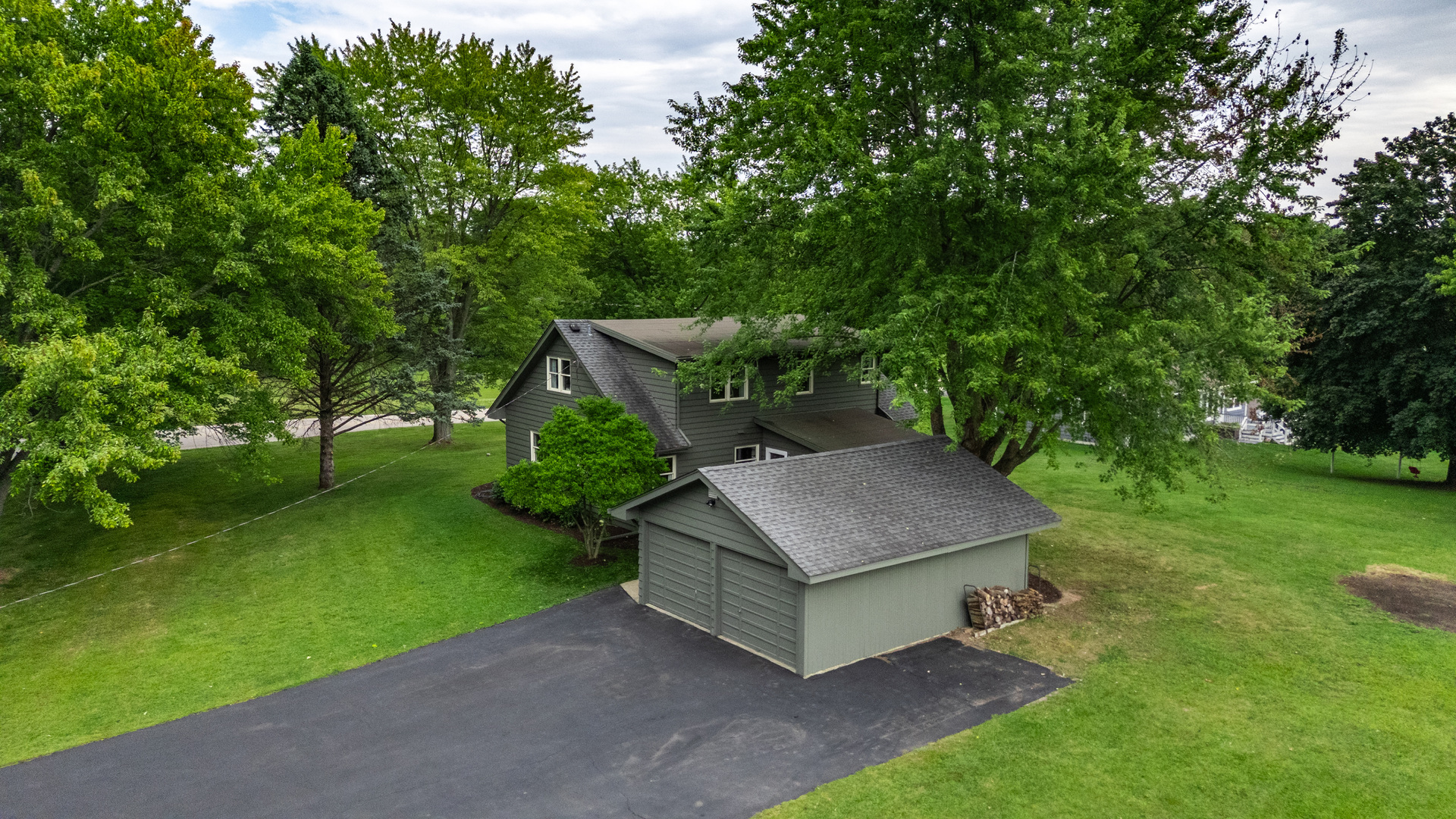 40w897 Brown Road St. Charles, IL 60175 - Photo 5 of 35 a wooden fence with some trees in the background