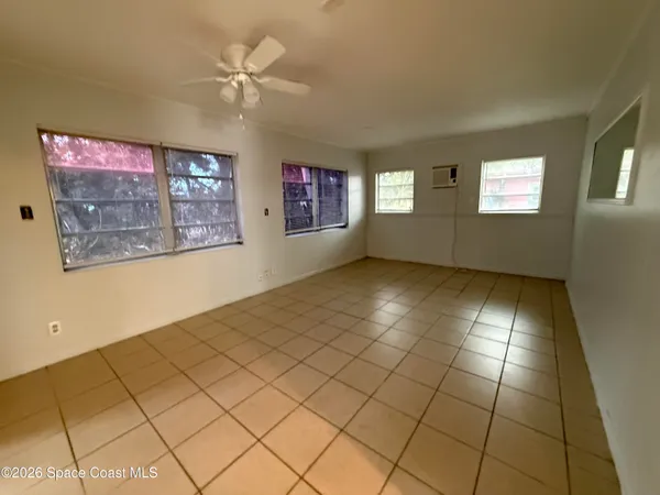 a view of an empty room and window