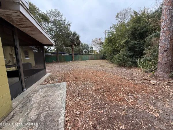 a view of a backyard with a trees