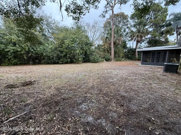 a view of backyard with green space