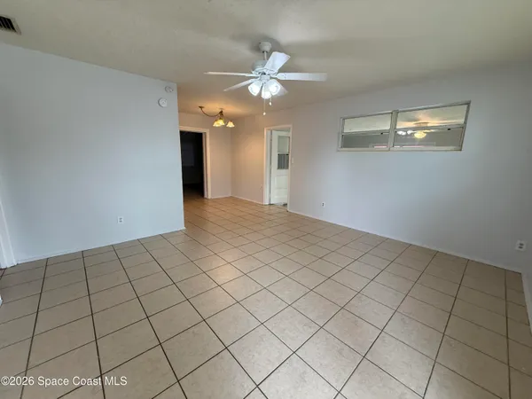 a view of an empty room and window