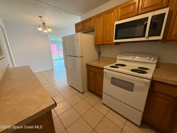 a kitchen with a stove and a microwave