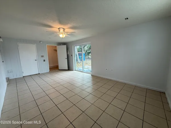 a view of an empty room and window