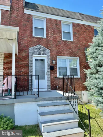 a front view of a house with glass windows and door