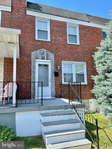 a front view of a house with glass windows and door
