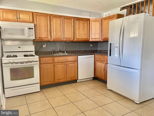 a view of a house with a yard and plants