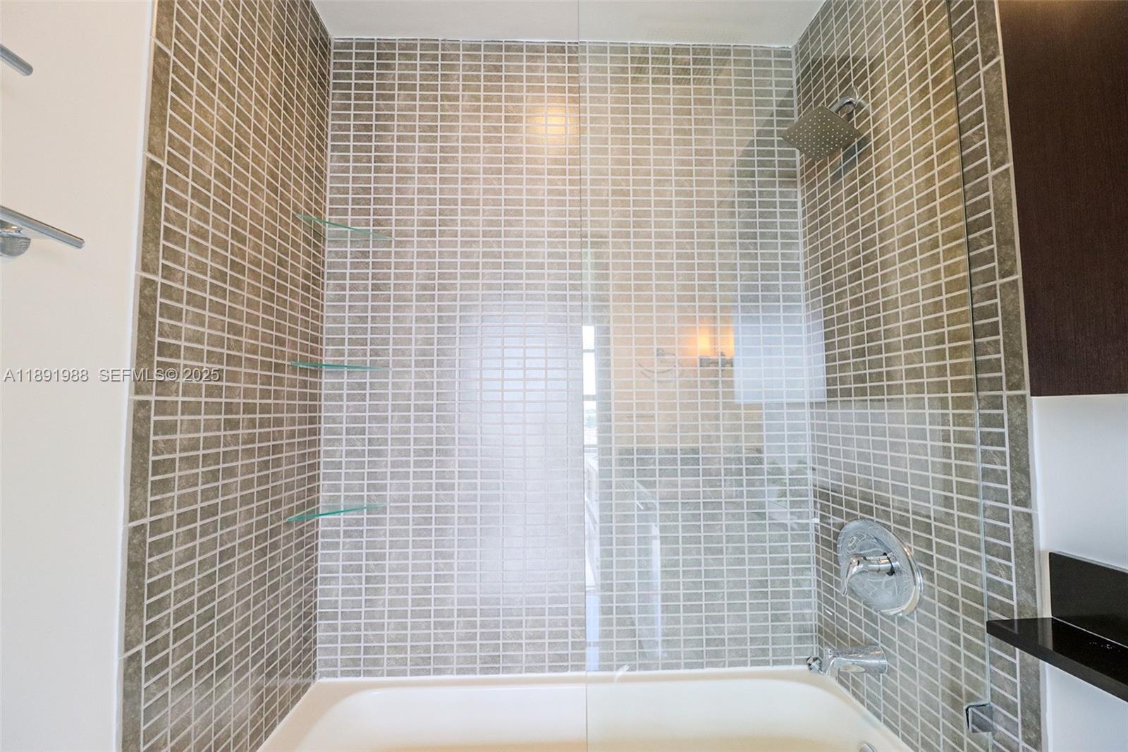 3451 Northeast 1st Avenue, Unit M0804 Miami, FL 33137 - Photo 14 of 39 a bathroom with a shower