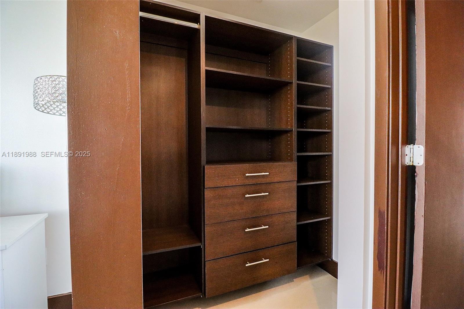 3451 Northeast 1st Avenue, Unit M0804 Miami, FL 33137 - Photo 21 of 39 a view of walk in closet