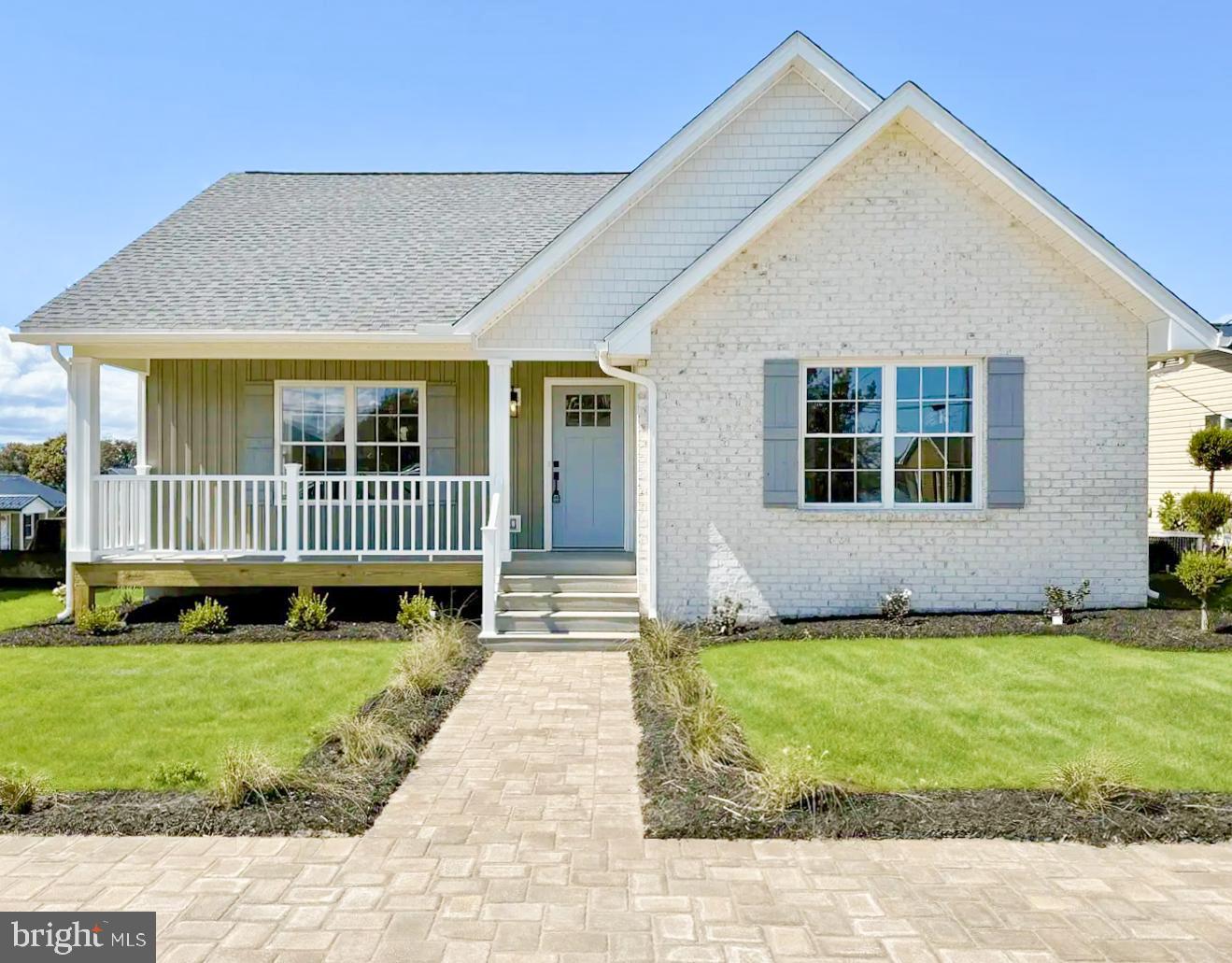 a view of a house with a yard and deck