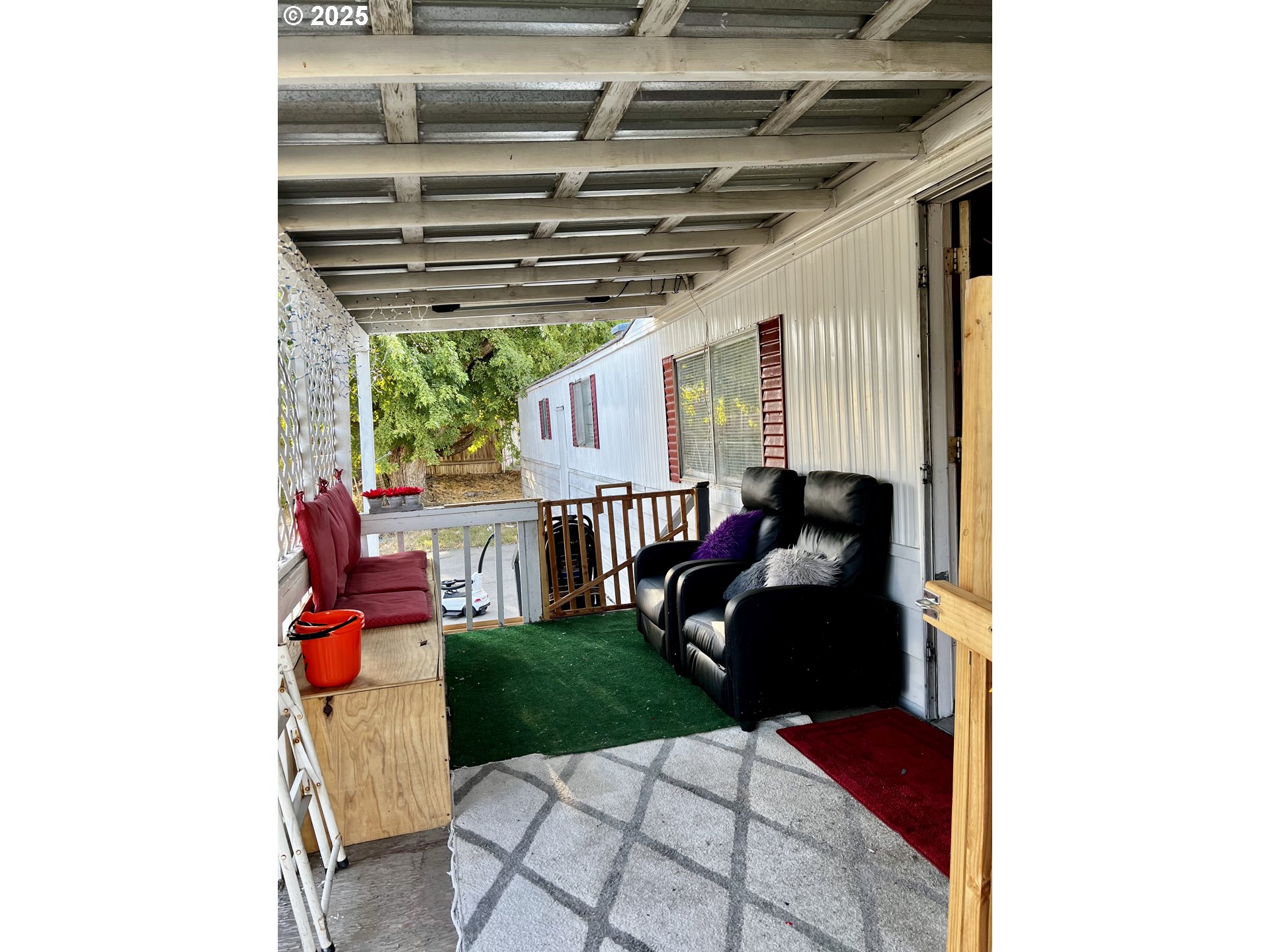 1030 Southwest 11th Street, Unit 33 Hermiston, OR 97838 - Photo 2 of 12 a living room with furniture and a large window