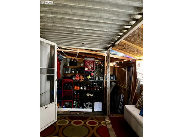 a view of walk in closet with wine