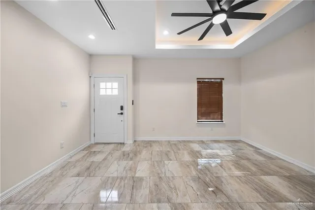 a view of kitchen with refrigerator stove microwave and cabinets