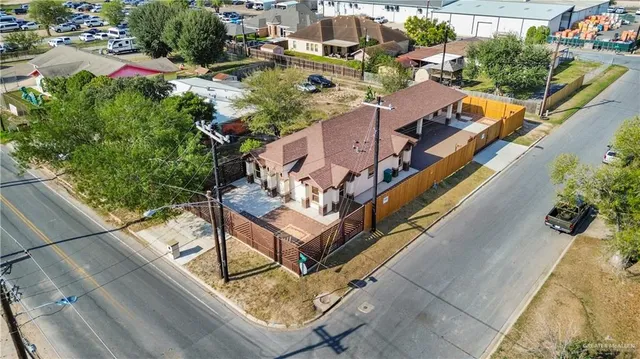 an aerial view of a house with swimming pool