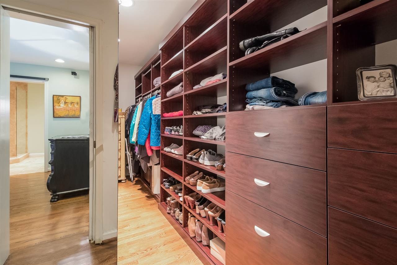 2908 Sandia Drive Raleigh, NC 27607 - Photo 14 of 29 Who wouldn't want this Closets by Design custom closet? Master Closet