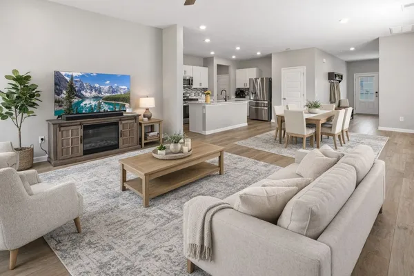 a living room with furniture and a fireplace