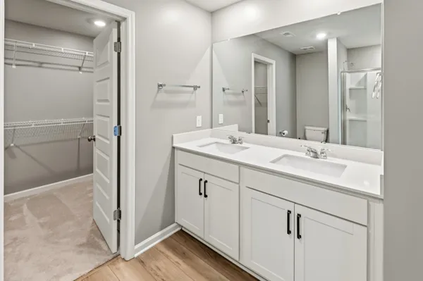 a bathroom that has a glass shower door