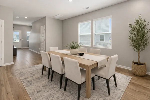 a view of a dining room with furniture and window
