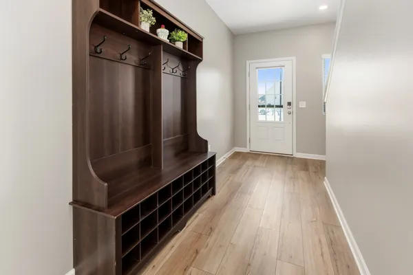 a view of an entryway with wooden floor