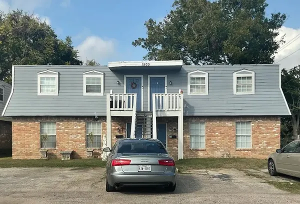 a car parked in front of a house