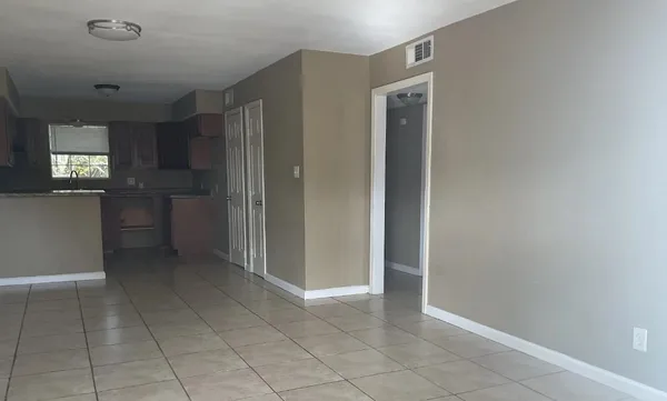 a view of kitchen with a sink and dishwasher cabinets