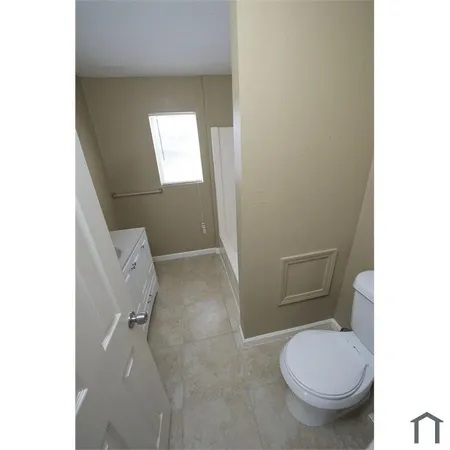 a bathroom with a toilet and a sink