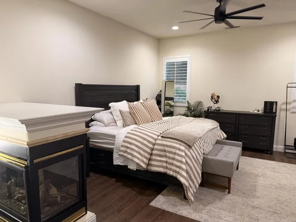 a bedroom with a bed and a dresser
