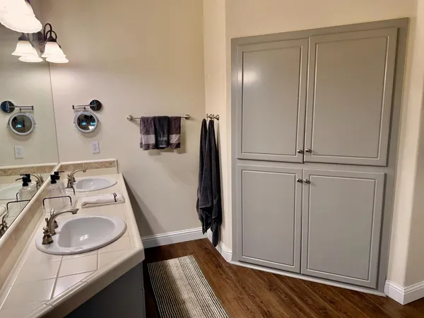 a bathroom with a sink and mirror