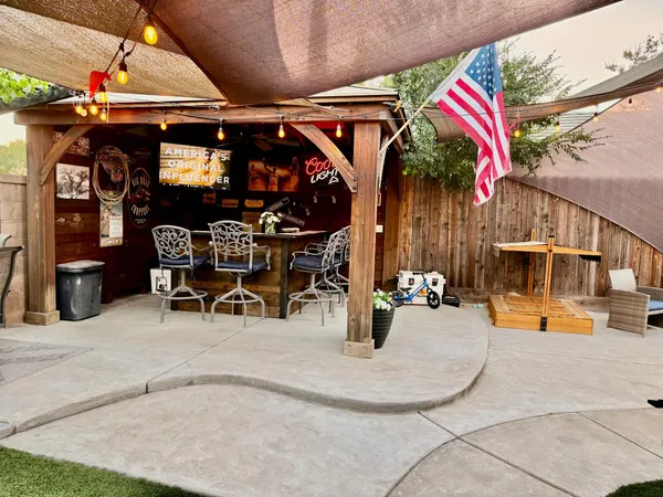 a view of a swimming pool with a patio