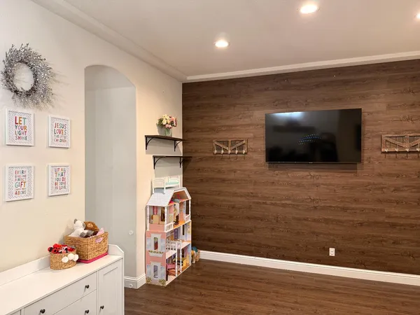a view of a livingroom with an empty space and a workspace