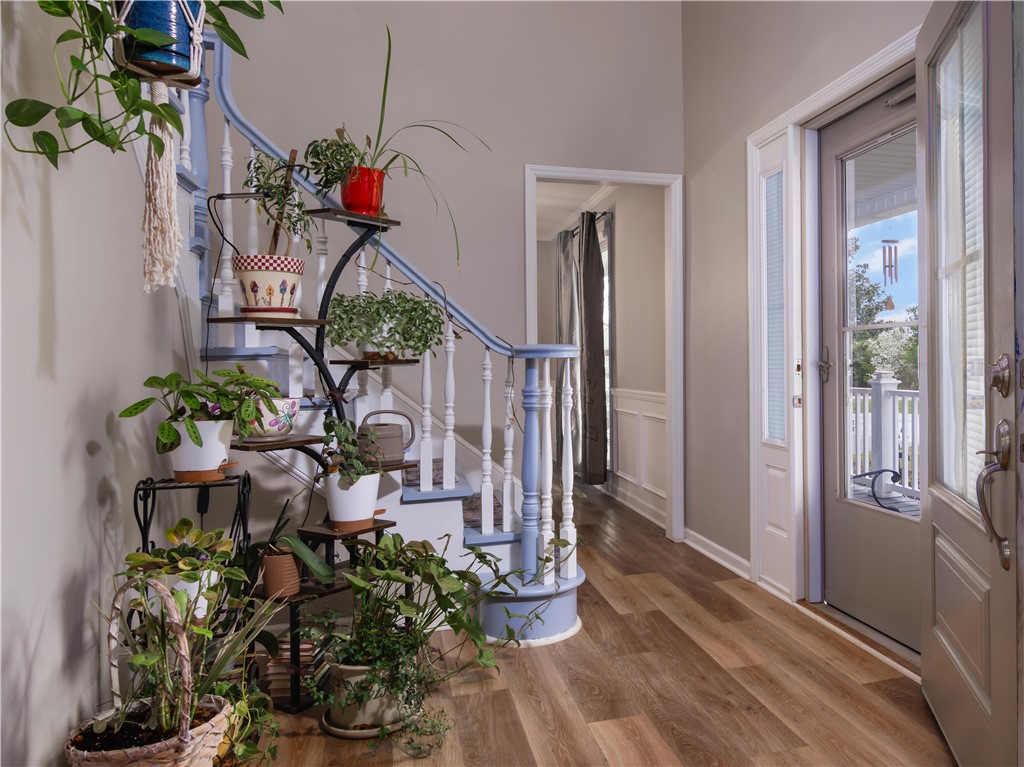 305 Farmdale Road Hodges, SC 29653 - Photo 12 of 48 Enter into a bright foyer featuring beautiful flooring and an inviting staircase.