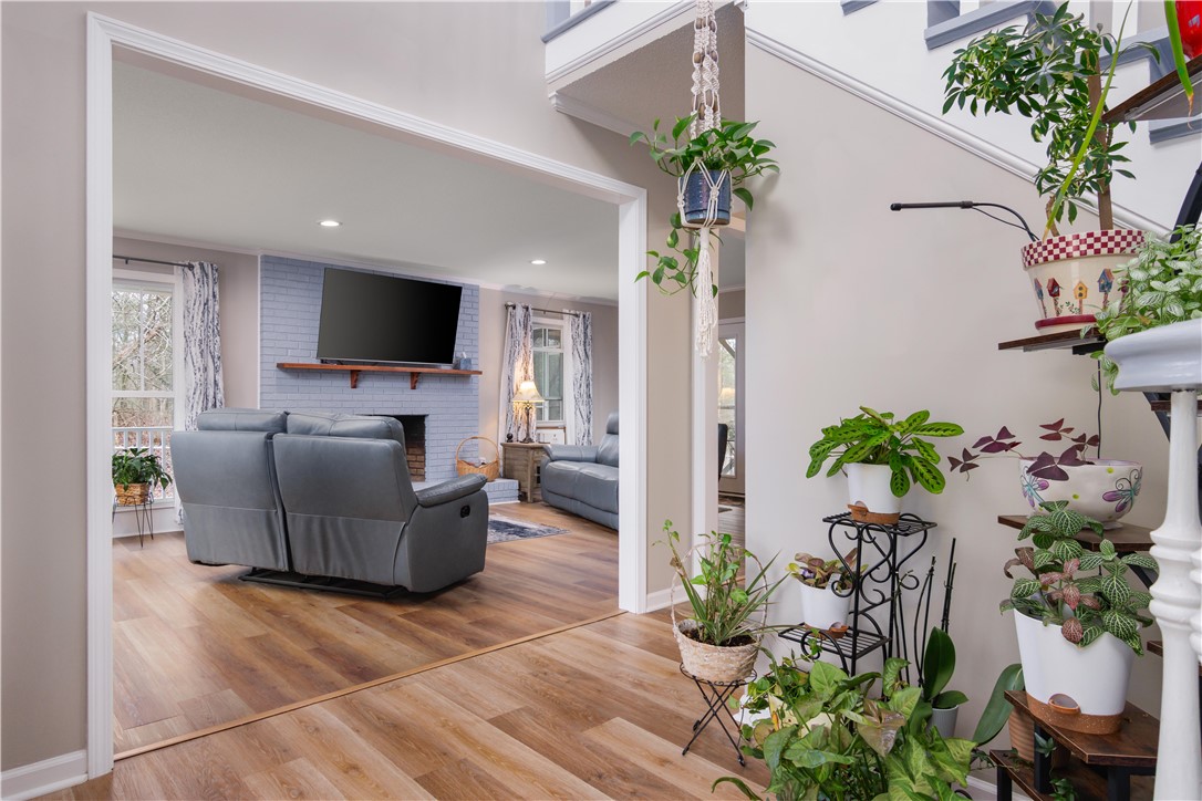 305 Farmdale Road Hodges, SC 29653 - Photo 47 of 48 This inviting home offers an open floor plan, warm flooring, and a cozy fireplace, perfect for relaxation.