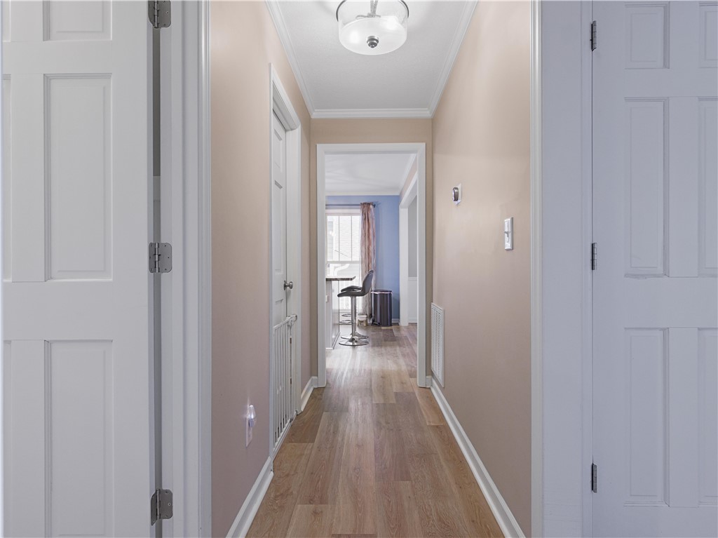 305 Farmdale Road Hodges, SC 29653 - Photo 16 of 48 This inviting hallway features sleek flooring and bright lighting, guiding you through this charming home.