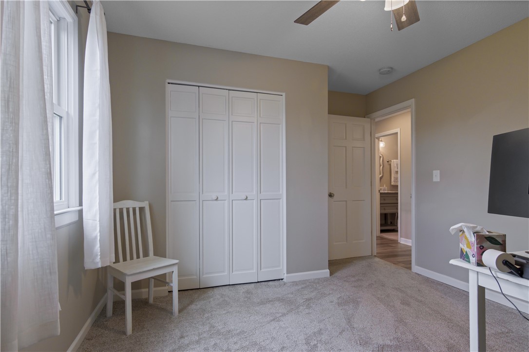 305 Farmdale Road Hodges, SC 29653 - Photo 29 of 48 This cozy room offers soft carpeting and a glimpse into an adjoining bathroom.