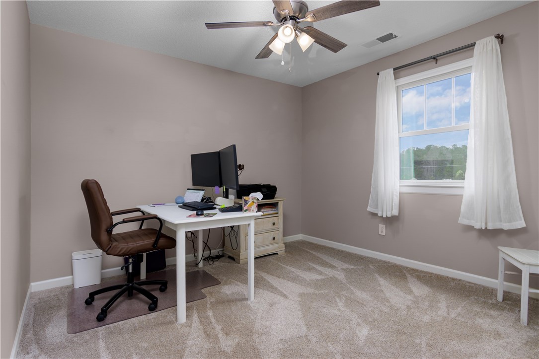305 Farmdale Road Hodges, SC 29653 - Photo 30 of 48 This versatile room offers an ideal setting for a home office or a comfortable guest space.