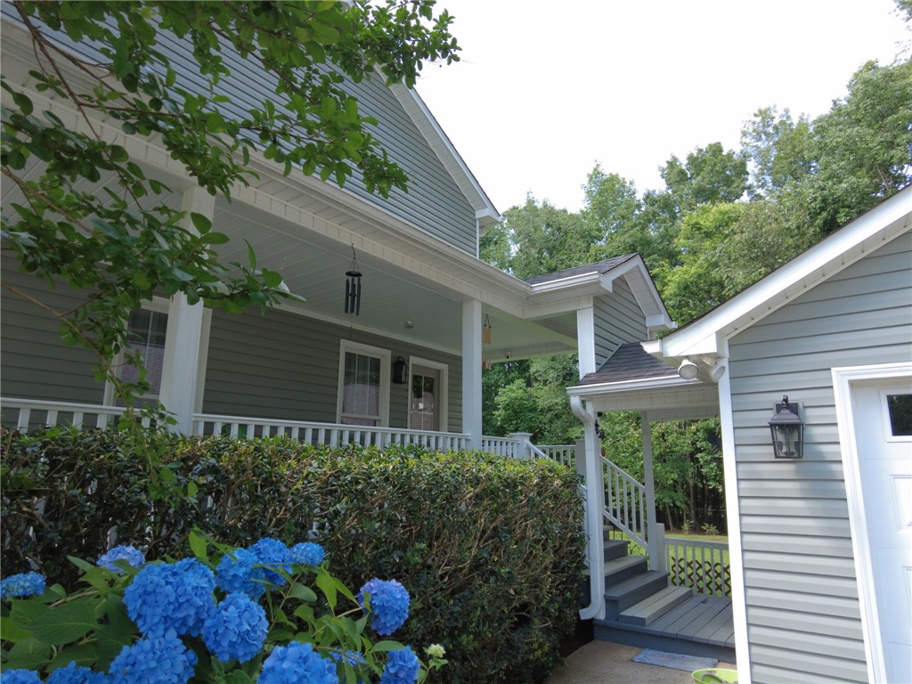 305 Farmdale Road Hodges, SC 29653 - Photo 33 of 48 This residence presents a welcoming facade with classic architectural details.