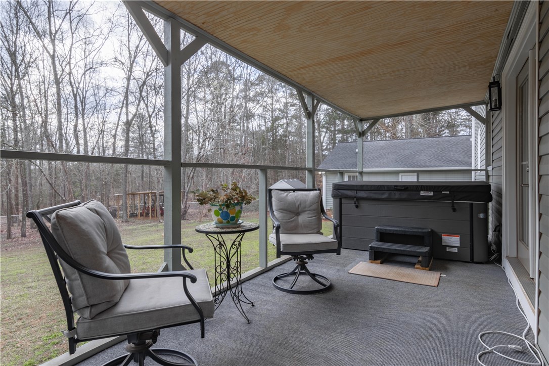 305 Farmdale Road Hodges, SC 29653 - Photo 40 of 48 This outdoor space provides a comfortable retreat with ample privacy and scenic views.