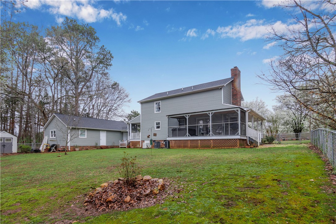 305 Farmdale Road Hodges, SC 29653 - Photo 43 of 48 This spacious property features a charming screened porch, perfect for enjoying outdoor moments.