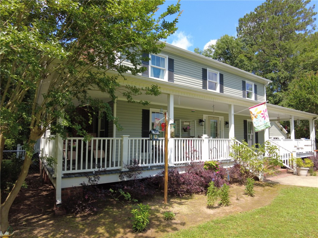 305 Farmdale Road Hodges, SC 29653 - Photo 5 of 48 This classic two-story residence features a welcoming full-length porch, perfect for outdoor enjoyment.