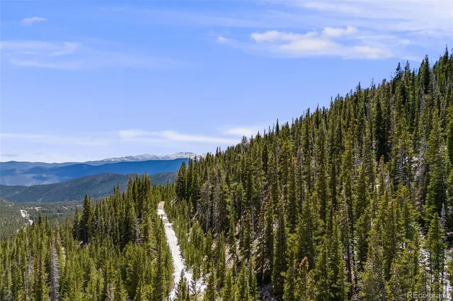 a view of mountain with sunset view
