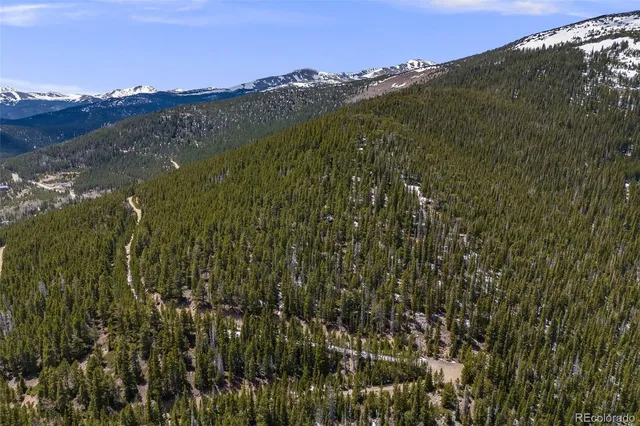 a view of a city with mountains in the background
