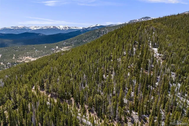 a view of mountain with sunset