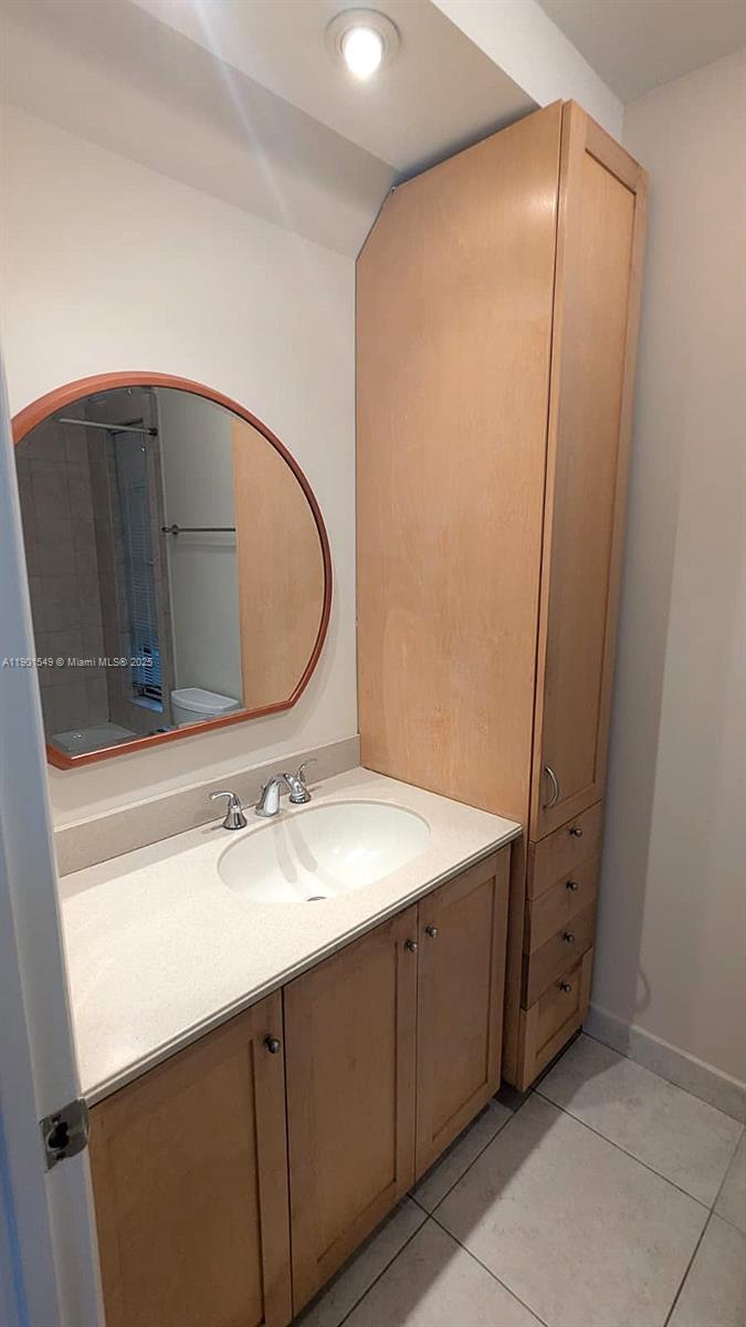 10140 Torchwood Avenue Plantation, FL 33324 - Photo 11 of 18 a bathroom with a sink and a mirror