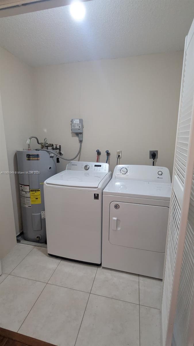10140 Torchwood Avenue Plantation, FL 33324 - Photo 13 of 18 a utility room with dryer and washer