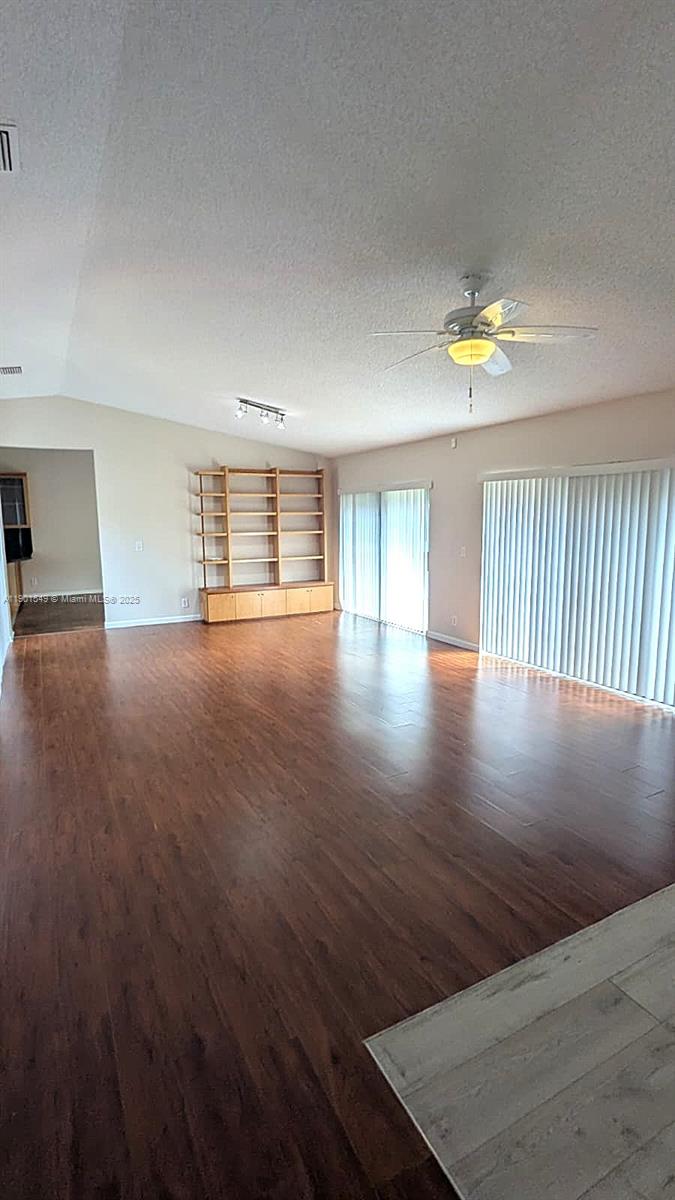 10140 Torchwood Avenue Plantation, FL 33324 - Photo 4 of 18 a view of an empty room with a window