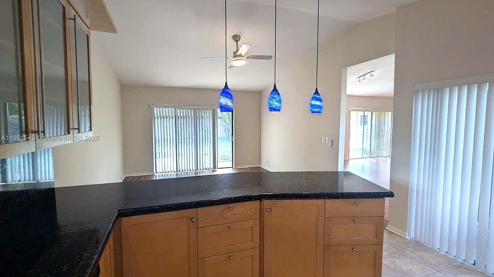 10140 Torchwood Avenue Plantation, FL 33324 - Photo 8 of 18 wooden floor in an empty room with a window