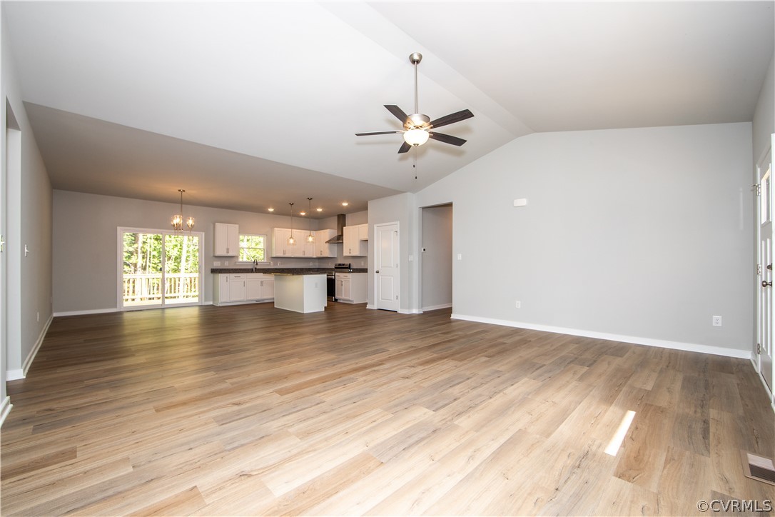 5740 New Line Road Gum Spring, VA 23065 - Photo 8 of 21 a view of an empty room with window and wooden floor