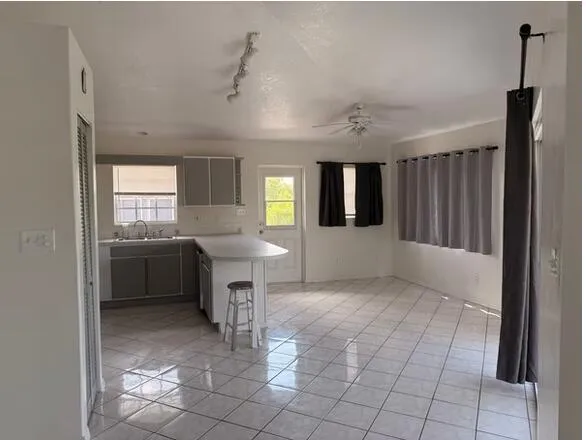a view of kitchen with furniture and window