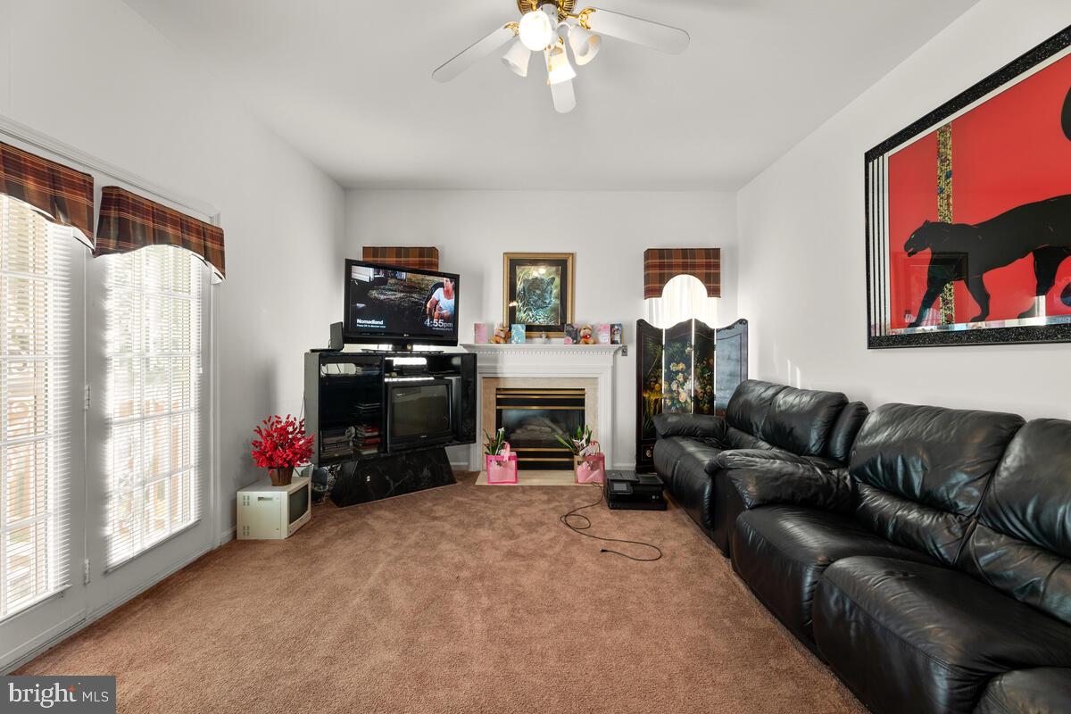10105 Cudby Court Lanham, MD 20706 - Photo 16 of 44 The family with gas fireplace & deck access!