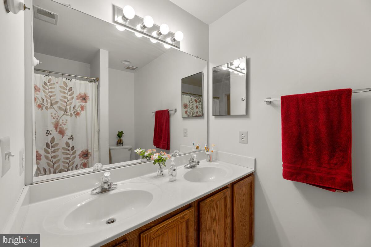 10105 Cudby Court Lanham, MD 20706 - Photo 26 of 44 Your Hall Bath features dual sinks & tub/shower!