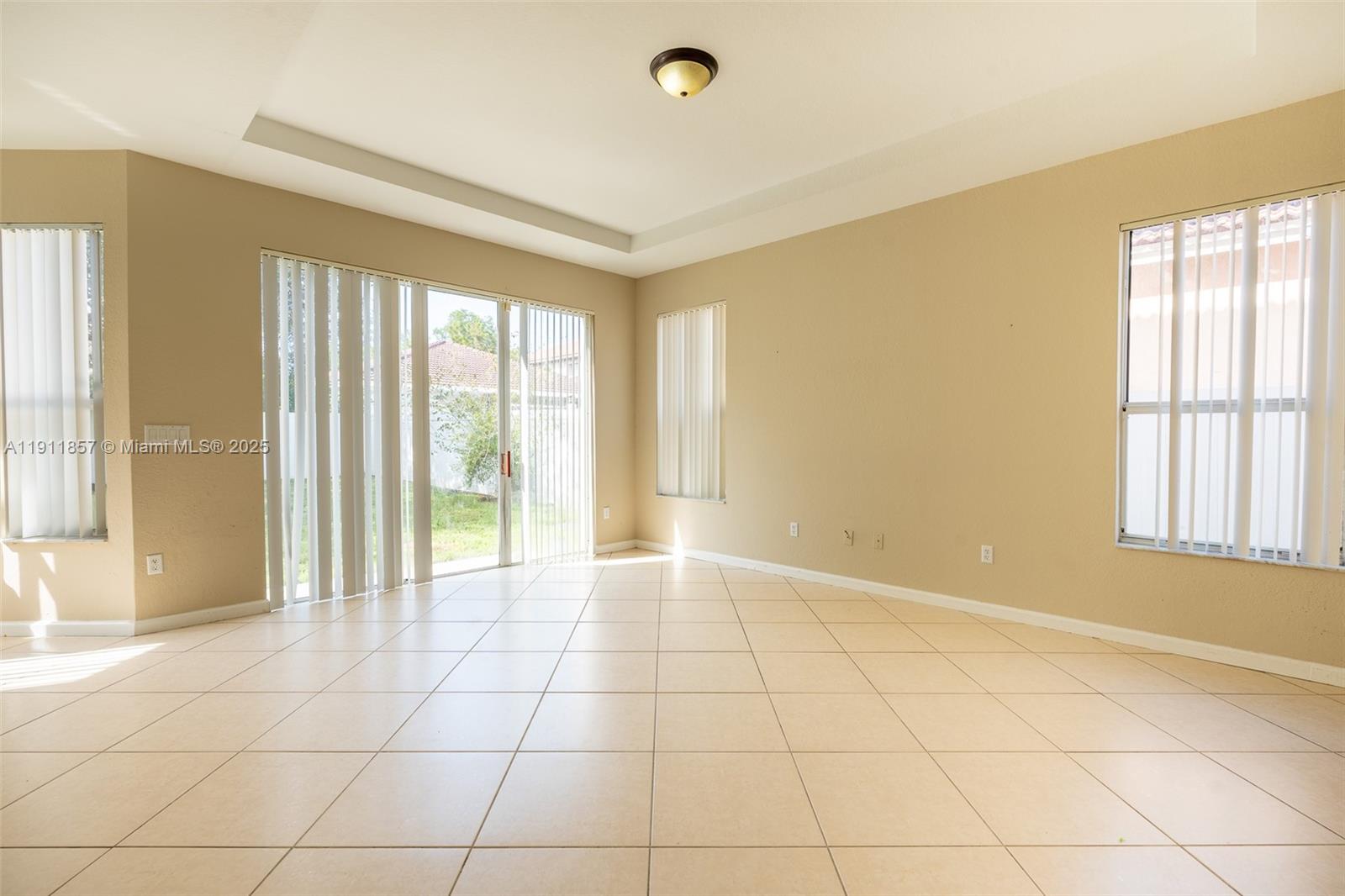 1770 Northeast 37th Place Homestead, FL 33033 - Photo 14 of 39 a view of an empty room with a window